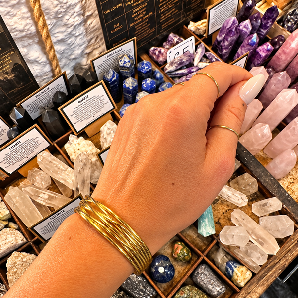 Gold statement cuff of fine crossing bands worn on the wrist - Let's Jam, Camden Town London
