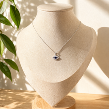 Load image into Gallery viewer, Close-up of the evil eye charm, blue and white stones set in a slim frame - Let's Jam jewellery, Camden Market London
