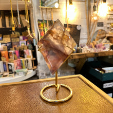 Load image into Gallery viewer, Fire quartz freeform standing on its gold stand - Let's Jam, Camden Market, London
