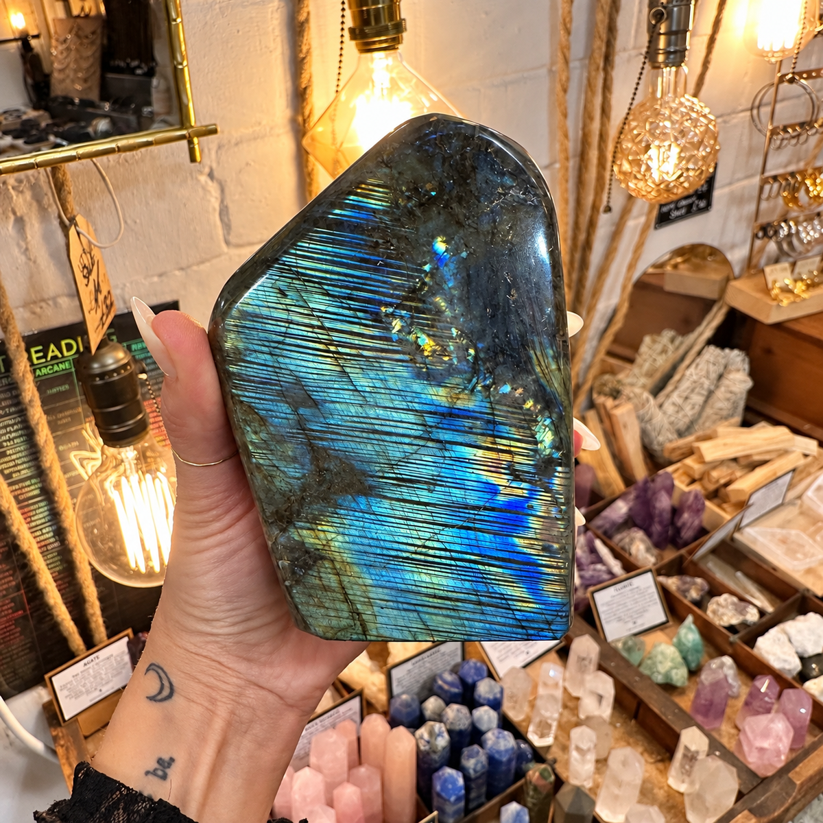 Large polished labradorite freeform flashing electric blue and gold, held in one hand - Let's Jam, Camden Market, London