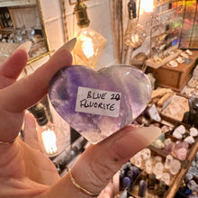 Load image into Gallery viewer, Fluorite heart held in the hand to show its polished banding - Let's Jam, Camden Market London
