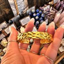 Load image into Gallery viewer, Hammer textured gold cuff bangle held in the hand - Let's Jam, Camden Market, London
