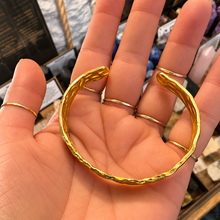 Load image into Gallery viewer, Hammer textured gold cuff laid in the palm - Let's Jam jewellery, Camden Town
