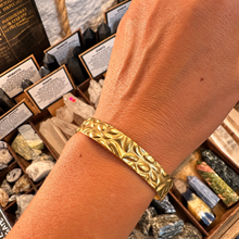 Load image into Gallery viewer, Textured gold cuff bangle worn on the wrist - Let's Jam, Camden Market London
