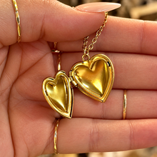 Load image into Gallery viewer, Gold heart locket opened in the hand - Let's Jam, Camden Town

