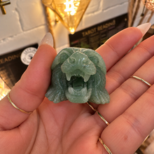 Load image into Gallery viewer, Front of the carved jade tiger showing its open roaring mouth, held in the palm - Let's Jam jewellery, Camden Market London
