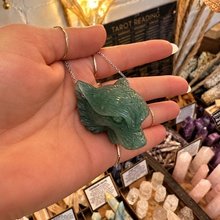 Load image into Gallery viewer, Jade tiger pendant hanging on its chain from the hand - Let's Jam, Camden Town London
