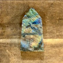 Load image into Gallery viewer, Labradorite obelisk lying on a wooden table - Let's Jam, Camden Market, London

