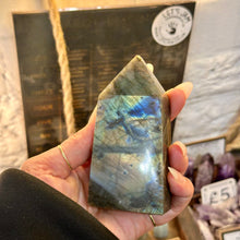 Load image into Gallery viewer, Side view of the labradorite obelisk held in the hand - Let's Jam, Camden Town London
