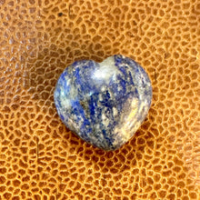 Load image into Gallery viewer, Polished lapis lazuli heart in deep blue on a textured tan surface - Let's Jam, Camden Market
