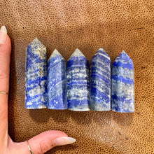 Load image into Gallery viewer, Five blue lapis lazuli towers beside a hand, a second view - Let's Jam, Camden Market
