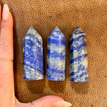 Load image into Gallery viewer, Lapis lazuli towers eleven to thirteen next to a hand to show their size - Let's Jam, Camden Town
