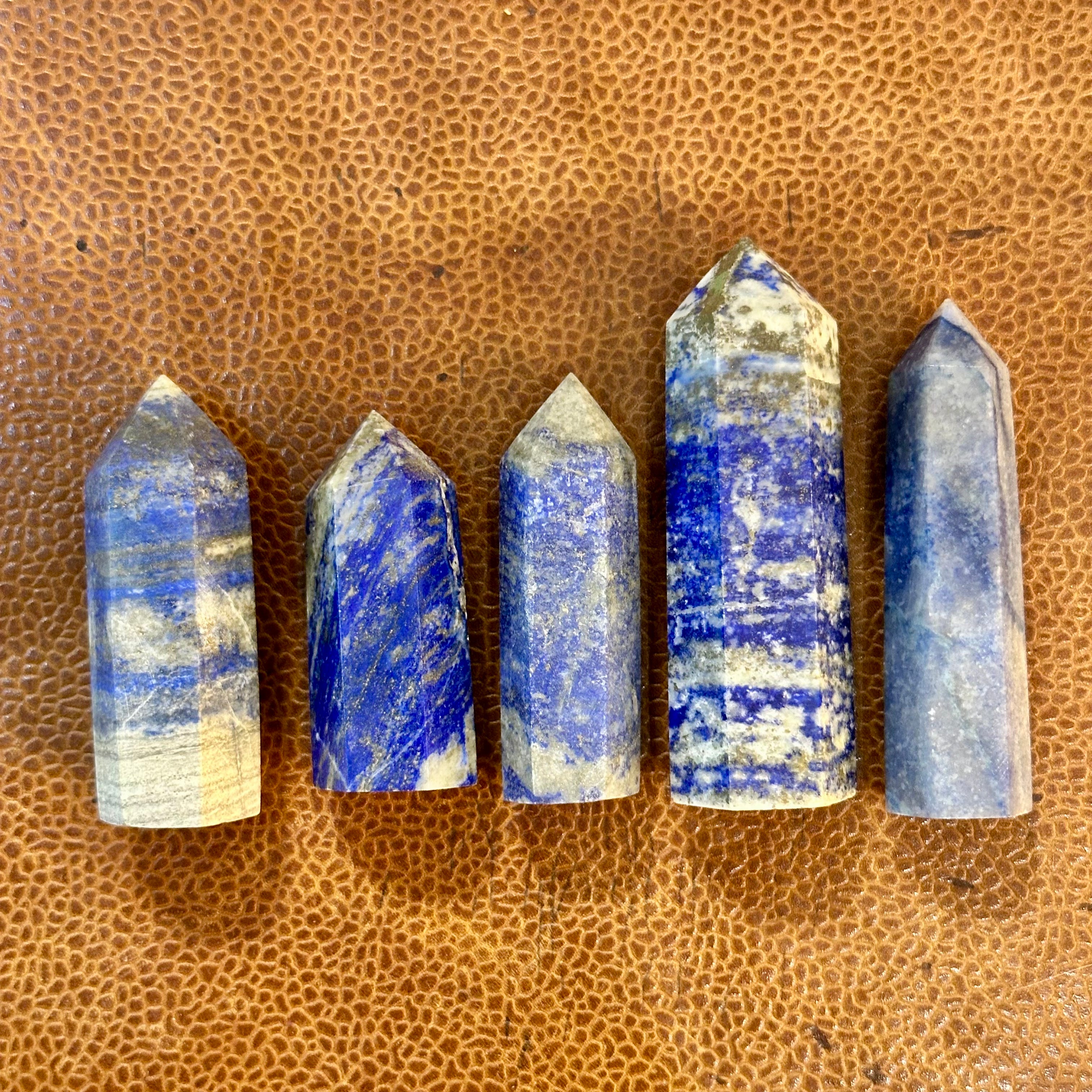 Lapis lazuli towers six to ten on a leather surface - Let's Jam, Camden Market London