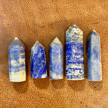 Load image into Gallery viewer, Lapis lazuli towers six to ten on a leather surface - Let's Jam, Camden Market London
