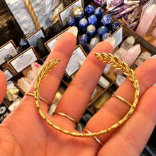 Load image into Gallery viewer, Gold leaf cuff laid open in the palm - Let's Jam, Camden Market London

