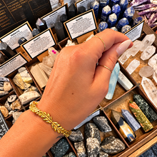Load image into Gallery viewer, Gold leaf cuff bangle worn on the wrist - Let's Jam, Camden Market, London
