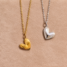 Load image into Gallery viewer, Gold and silver love heart pendants on chains - Let's Jam, Camden Market
