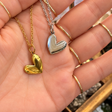 Load image into Gallery viewer, Gold and silver love heart necklaces held in the hand - Let's Jam, Camden Market, London

