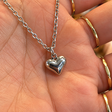 Load image into Gallery viewer, Silver puffed love heart pendant held in the hand - Let's Jam, Camden Market
