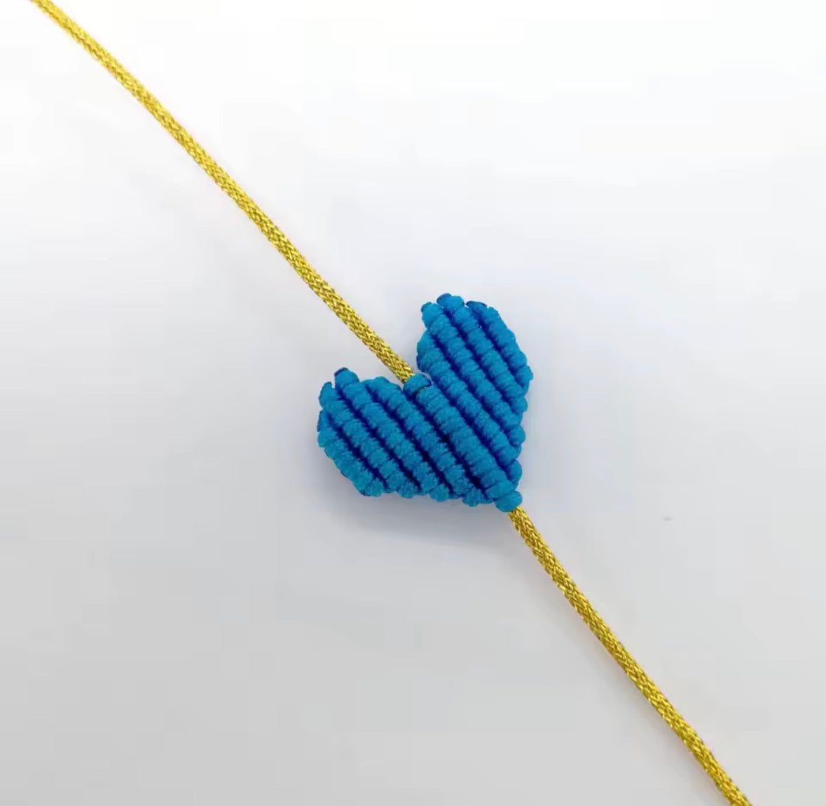Blue macramé heart bracelet on a gold cord - Let's Jam, Camden Market, London