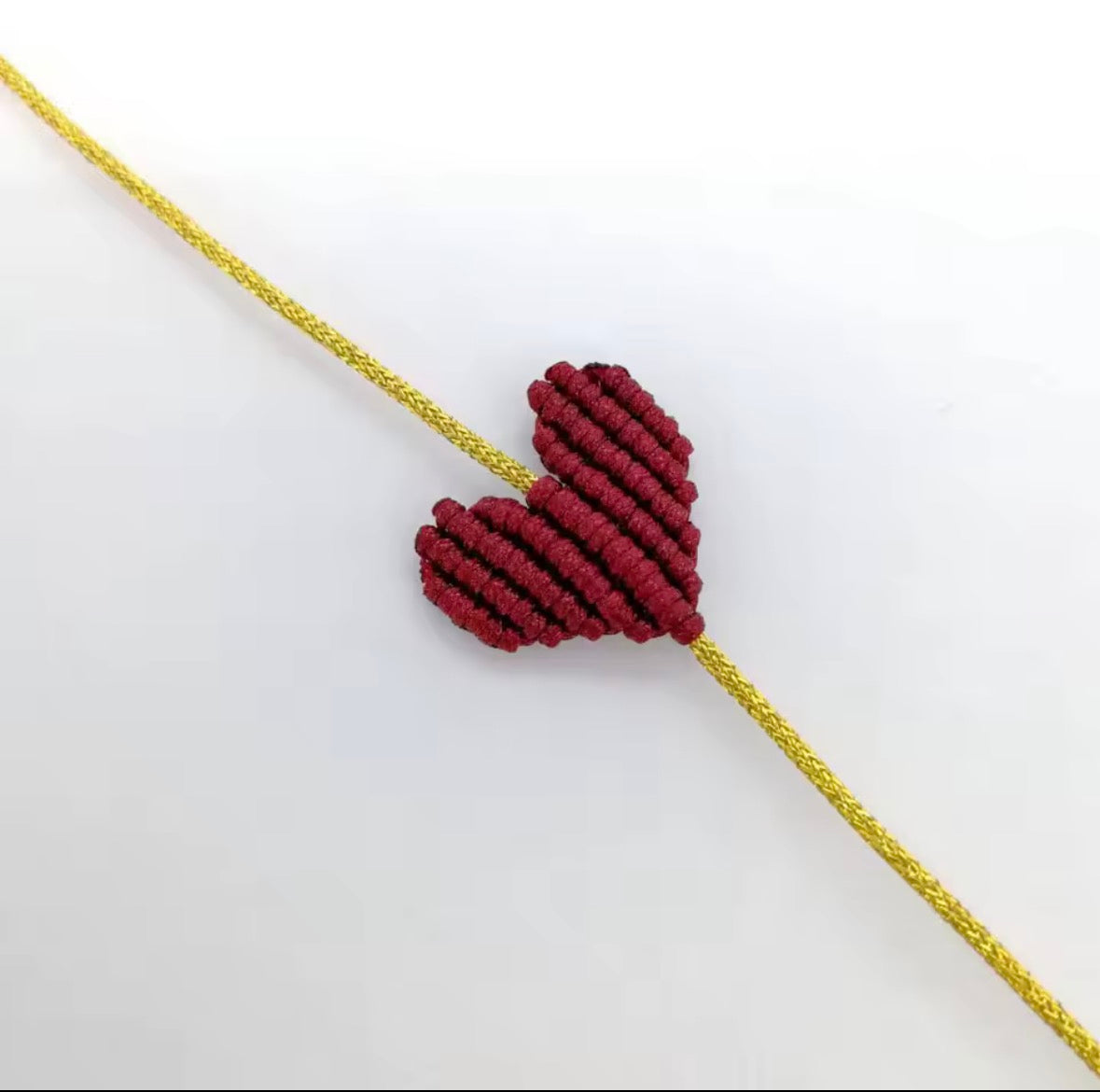 Burgundy macramé heart bracelet on a gold cord - Let's Jam, Camden Town