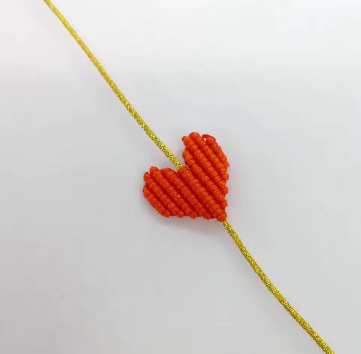 Orange macramé heart bracelet on a gold cord - Let's Jam, Camden Town