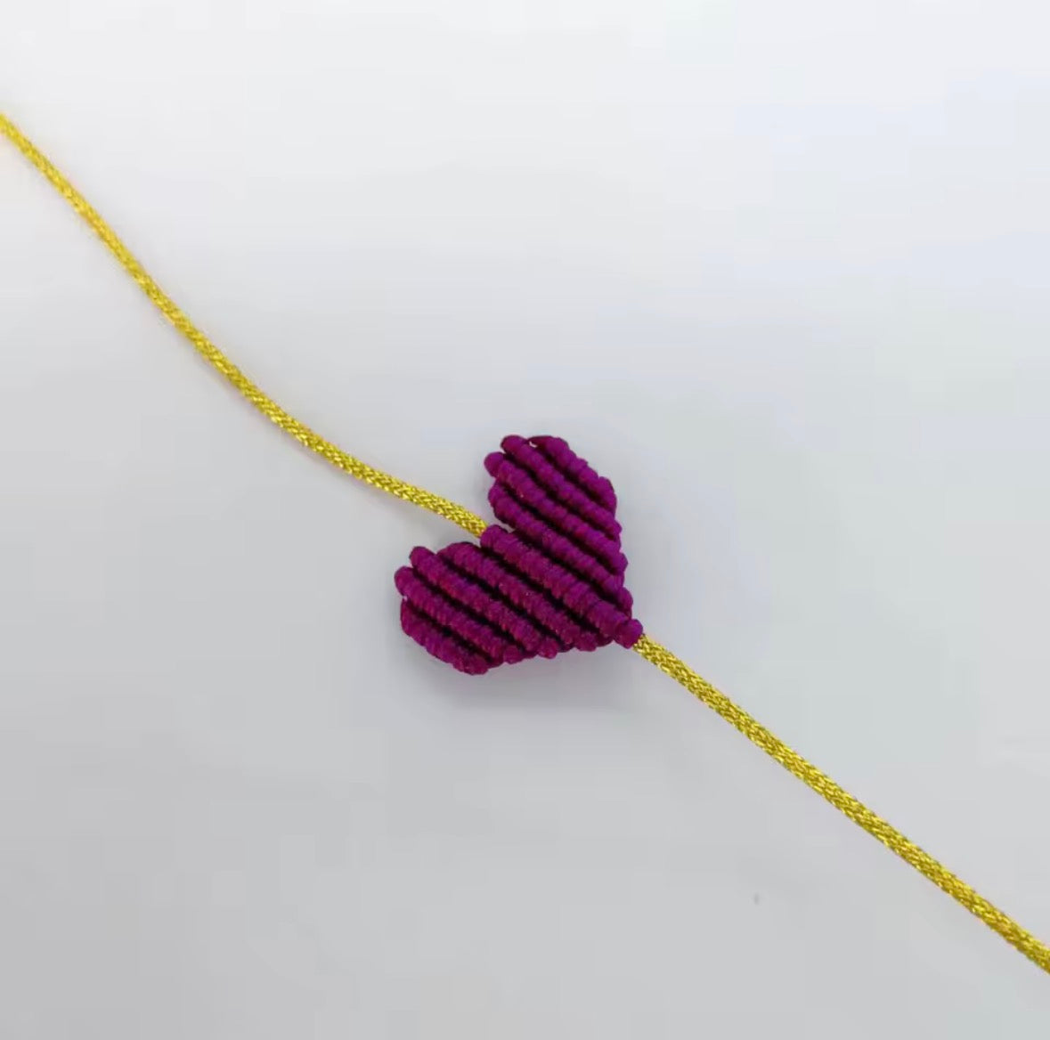 Plum macramé heart bracelet on a gold cord - Let's Jam, Camden Market