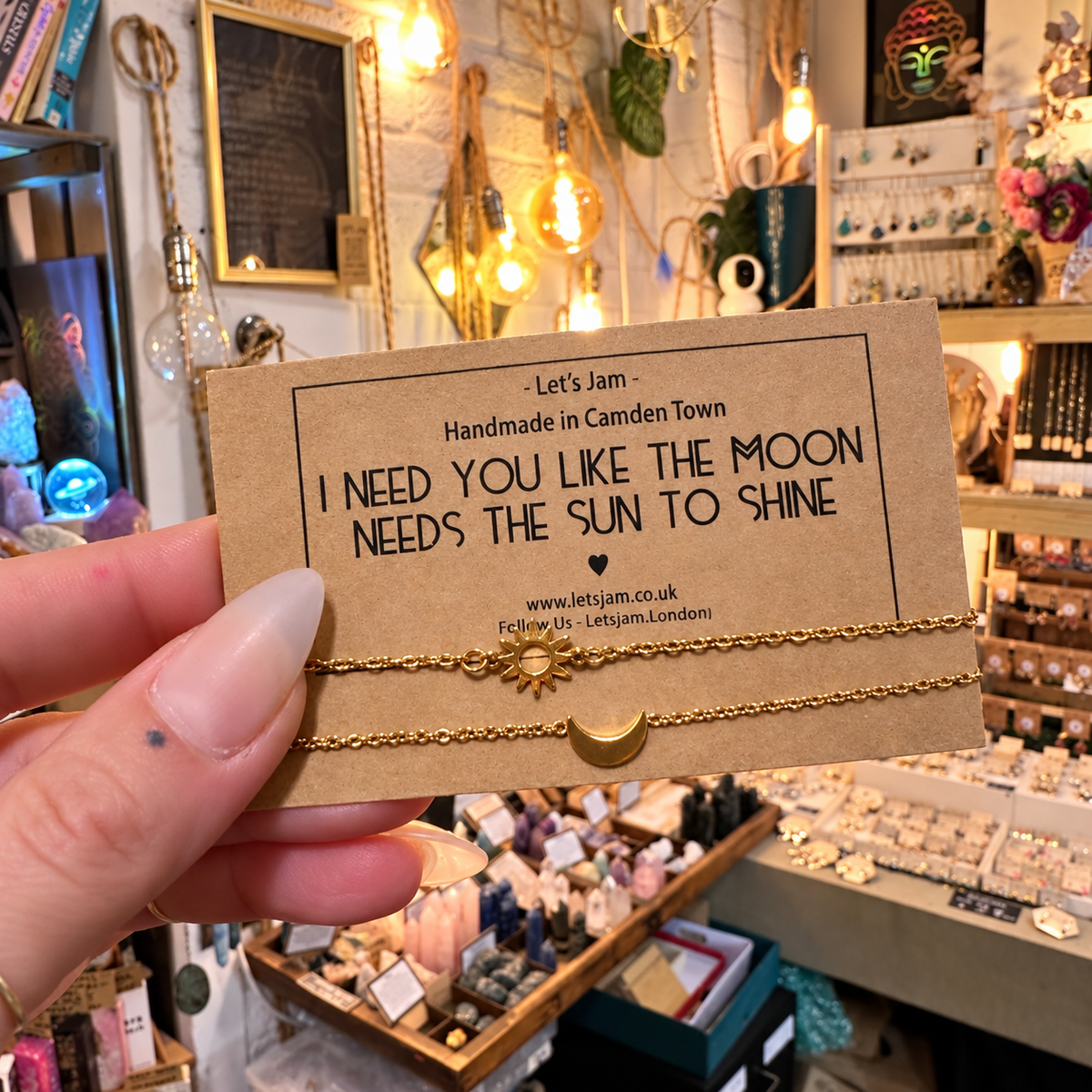 Two gold chain bracelets with sun and moon charms on a Let's Jam "I Need You Like The Moon Needs The Sun To Shine" card - Let's Jam, Camden Market, London