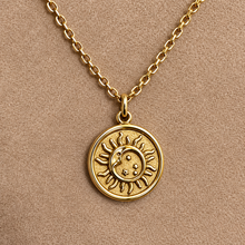 Load image into Gallery viewer, Gold moon and sun medallion pendant on a chain - Let's Jam, Camden Market London
