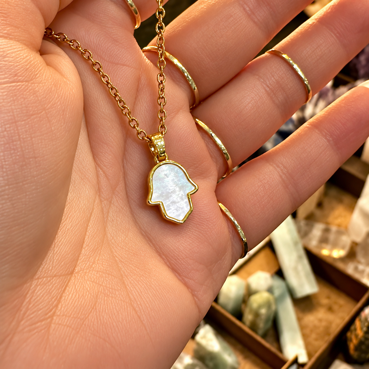 Mother of pearl hamsa hand pendant held in the hand - Let's Jam, Camden Market London