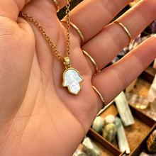 Load image into Gallery viewer, Mother of pearl hamsa hand pendant held in the hand - Let's Jam, Camden Market London
