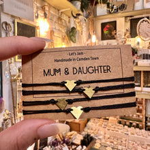 Load image into Gallery viewer, Set of black Mum &amp; Daughter matching bracelets with gold heart charms, adjustable - Let's Jam, Camden Market, London

