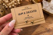 Load image into Gallery viewer, Gold chain bracelet with a little heart charm on a Let's Jam "Mum &amp; Daughter" card, with dried flowers and a brass lantern - Let's Jam, Camden Market, London
