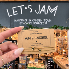 Load image into Gallery viewer, Two gold chain bracelets with heart charms on a Let's Jam "Mum &amp; Daughter" card - Let's Jam, Camden Market, London
