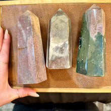 Load image into Gallery viewer, Ocean jasper trio laid out with a hand for scale - Let's Jam, Camden Market London

