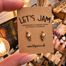 Load image into Gallery viewer, Pearl stud earrings with gold dot details on a card - Let's Jam jewellery, Camden Town London
