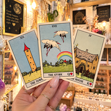 Load image into Gallery viewer, Three Lenormand cards held in the hand — the Tower, the Stork and the House - Let's Jam, Camden Market
