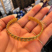 Load image into Gallery viewer, Gold plaited cuff bangle laid open in the palm - Let's Jam jewellery, Camden Market
