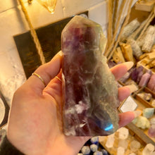 Load image into Gallery viewer, Purple fluorite tower held in the hand to show its size - Let's Jam, Camden Market
