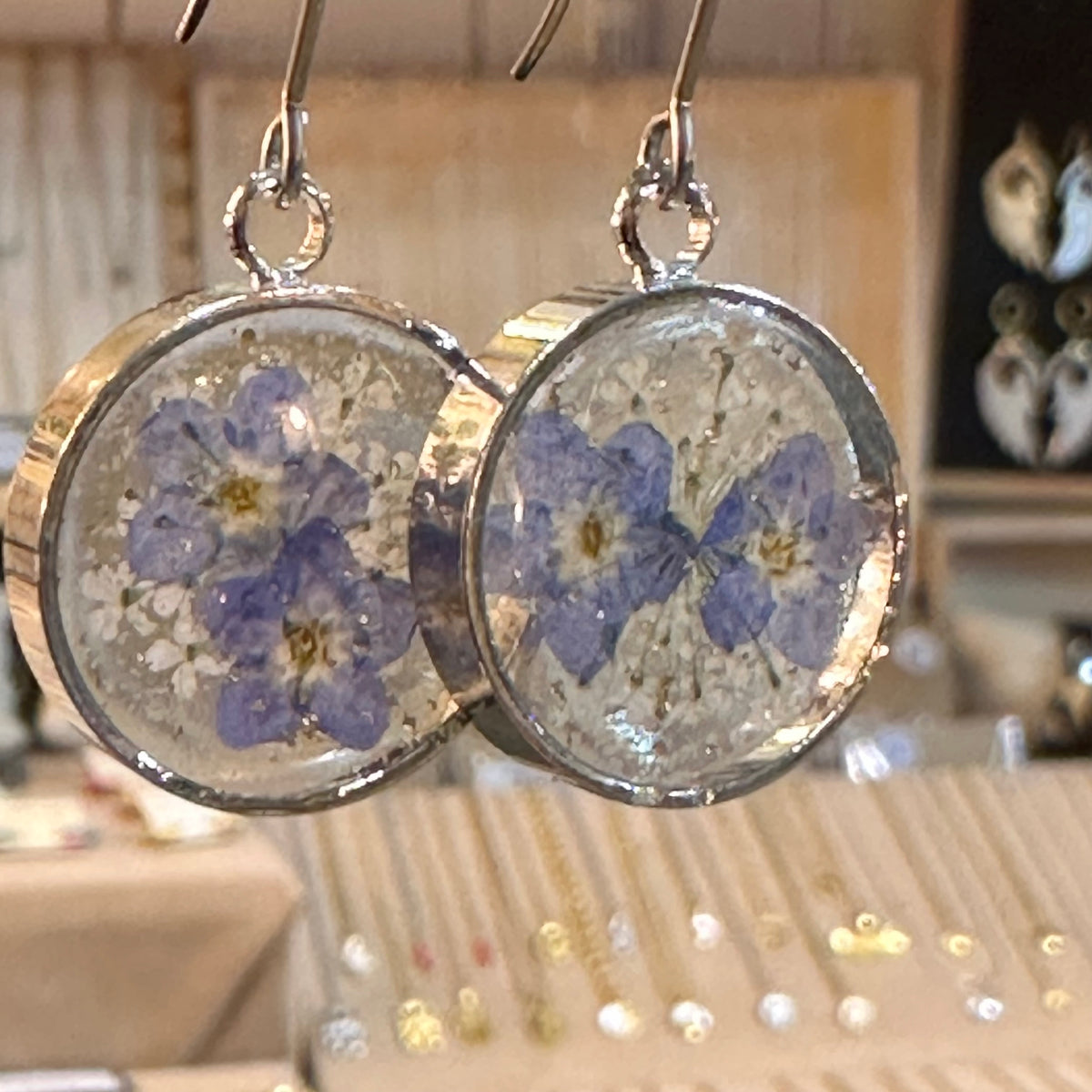 Round resin earrings with real blue pressed flowers in silver frames - Let's Jam jewellery, Camden Market