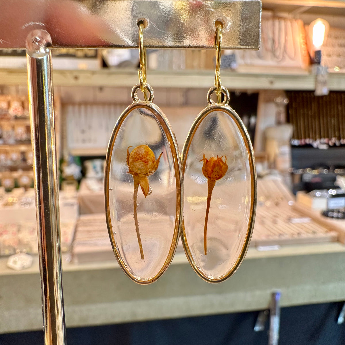 Oval resin earrings with a single real orange flower - Let's Jam, Camden Market