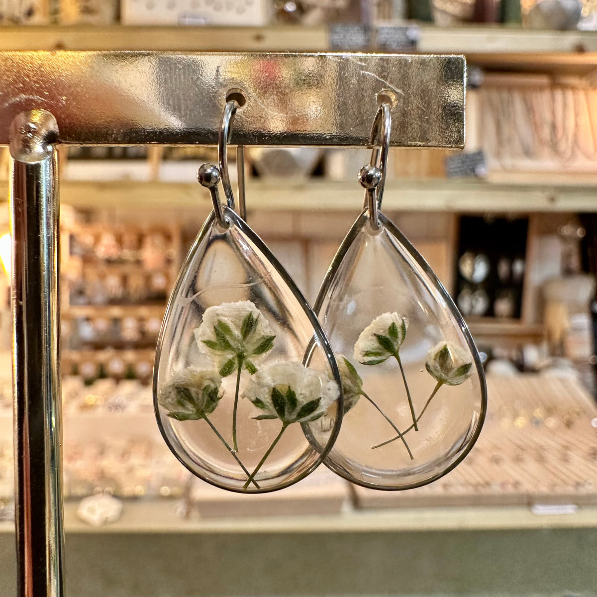 Teardrop resin earrings with real white flowers and green stems - Let's Jam jewellery, Camden Market, London