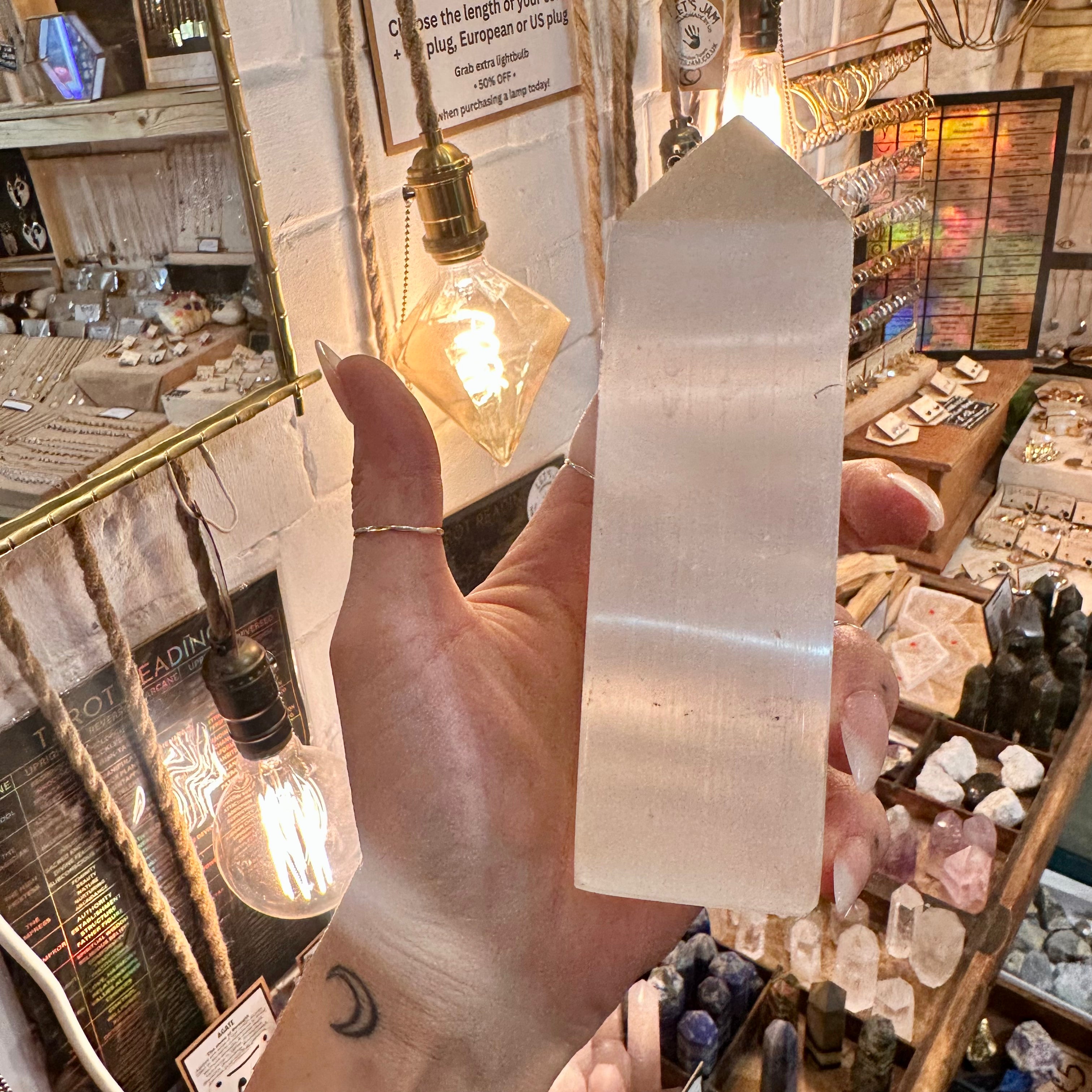 Polished selenite obelisk, a squared tower with a pointed tip - Let's Jam, Camden Market