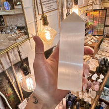 Load image into Gallery viewer, Polished selenite obelisk, a squared tower with a pointed tip - Let's Jam, Camden Market
