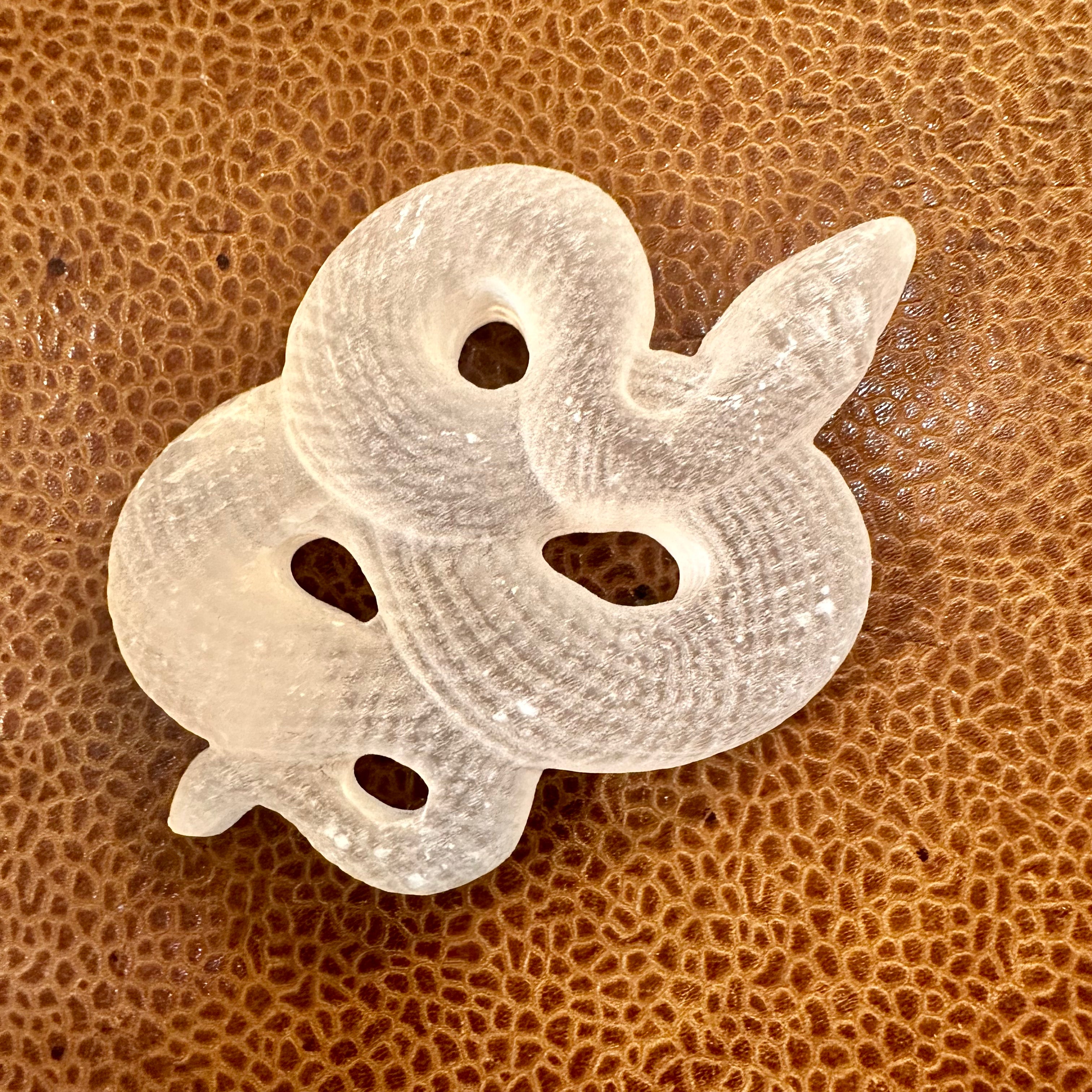 Hand-carved selenite snake resting on its own stand - Let's Jam, Camden Market