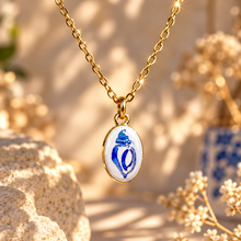 Load image into Gallery viewer, Oval ceramic pendant hand painted with a blue shell on a gold chain - Let's Jam, Camden Town
