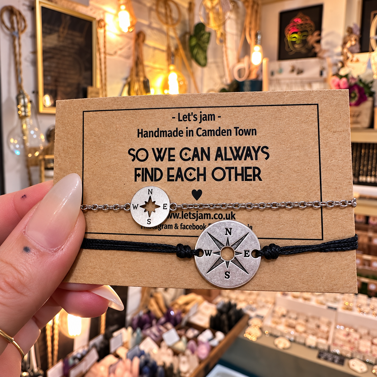 Black cord bracelets with silver compass charms on a So We Can Always Find Each Other card - Let's Jam, Camden Market London