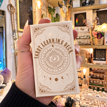 Load image into Gallery viewer, Tarot Learning Deck box in white and gold held in the hand - Let's Jam, Camden Market
