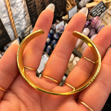 Load image into Gallery viewer, Textured gold cuff laid open in the palm - Let's Jam jewellery, Camden Market, London
