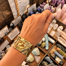 Load image into Gallery viewer, Wide rippled gold statement cuff worn on the wrist - Let's Jam jewellery, Camden Market London
